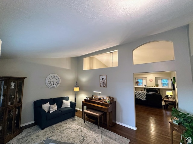8675 S Pebblecreek Rd, West Jordan, UT 84081 - living room with wood finished floors, baseboards, and vaulted ceiling