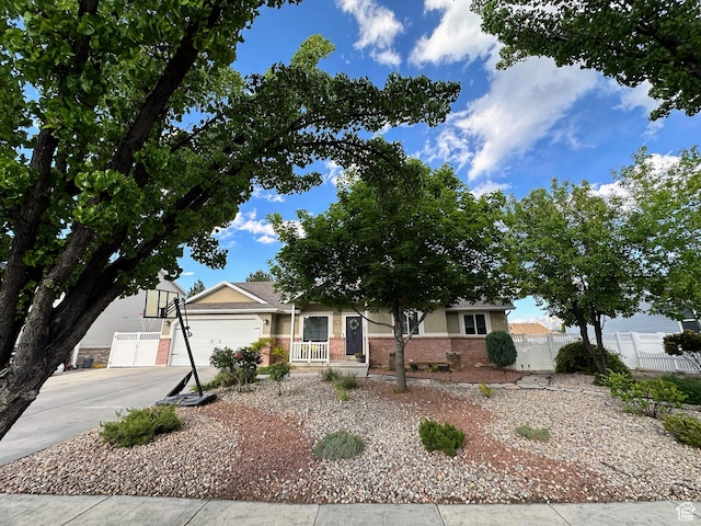 8675 S Pebblecreek Rd, West Jordan, UT 84081 - view of front of property featuring brick siding, concrete driveway, and a garage