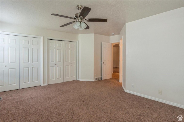 432 S 755 E, Layton, UT 84041 - unfurnished bedroom with carpet flooring, multiple closets, baseboards, a textured ceiling, and a ceiling fan