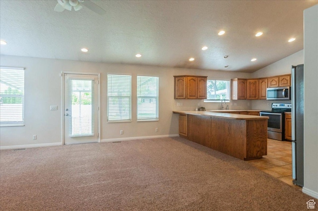 432 S 755 E, Layton, UT 84041 - kitchen featuring appliances with stainless steel finishes, recessed lighting, light carpet, a peninsula, and a sink