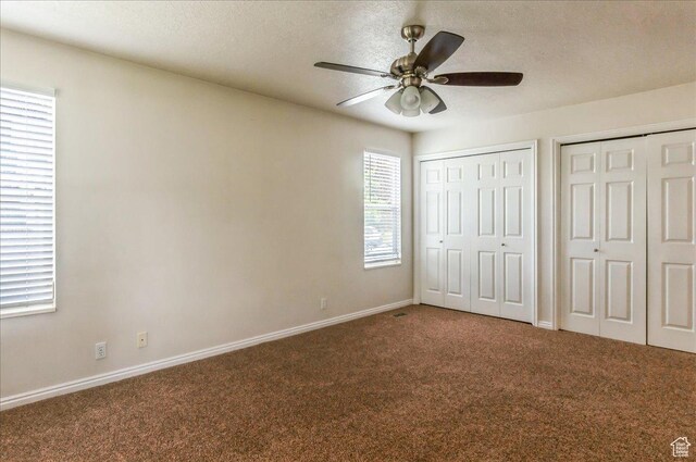 432 S 755 E, Layton, UT 84041 - unfurnished bedroom featuring carpet floors, two closets, baseboards, a textured ceiling, and ceiling fan