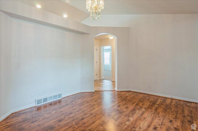 432 S 755 E, Layton, UT 84041 - spare room with arched walkways, wood finished floors, baseboards, a chandelier, and recessed lighting