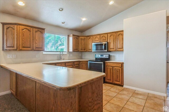 432 S 755 E, Layton, UT 84041 - kitchen featuring stainless steel appliances, a sink, brown cabinets, a peninsula, and light countertops