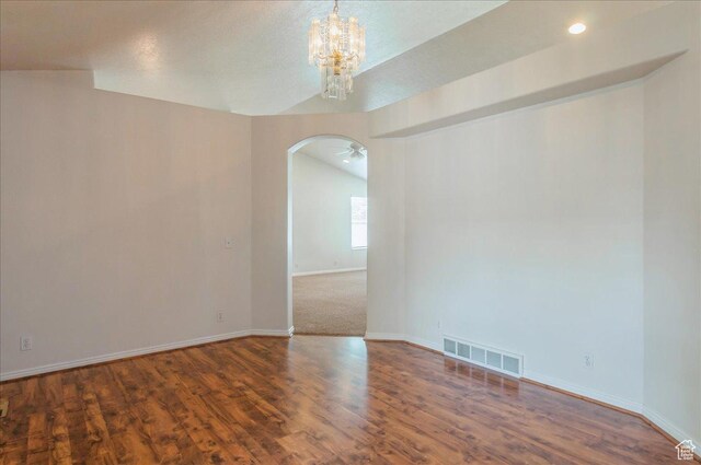 432 S 755 E, Layton, UT 84041 - empty room with arched walkways, a chandelier, baseboards, wood finished floors, and vaulted ceiling