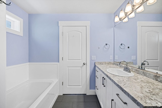 818 S 560 E, Providence, UT 84332 - bathroom with vanity, a garden tub, and tile patterned floors