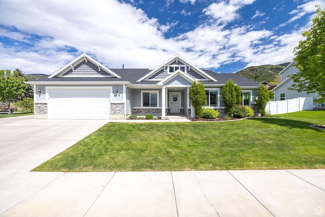 818 S 560 E, Providence, UT 84332 - craftsman-style house with stone siding, concrete driveway, a garage, and board and batten siding