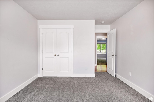 818 S 560 E, Providence, UT 84332 - unfurnished bedroom with carpet floors, baseboards, and a closet