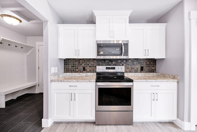 818 S 560 E, Providence, UT 84332 - kitchen featuring stainless steel appliances, light countertops, and white cabinetry