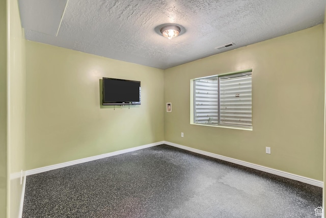 10972 S Crystal View Way S, Jordan, UT 84095 - unfurnished room with baseboards, a textured ceiling, and speckled floor