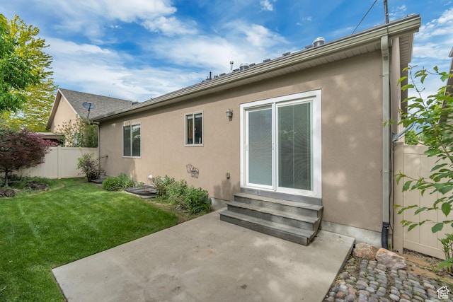 10972 S Crystal View Way S, Jordan, UT 84095 - rear view of property featuring entry steps, a patio, and stucco siding