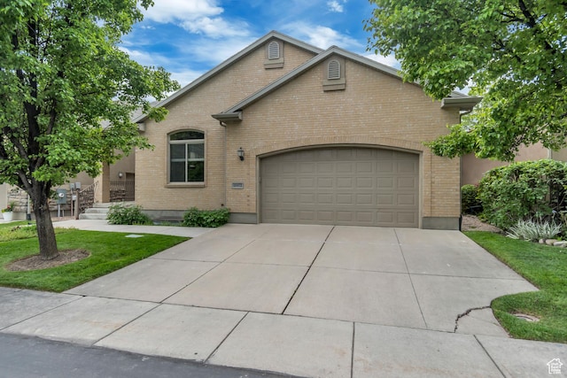 10972 S Crystal View Way S, Jordan, UT 84095 - view of front of property with brick siding, a garage, concrete driveway, and a front lawn