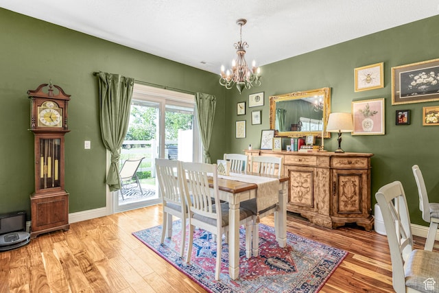 839 W Jordan Oaks Ct S, Sandy, UT 84070 - dining area featuring a chandelier, wood finished floors, and baseboards