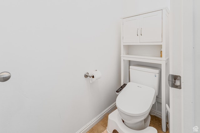 839 W Jordan Oaks Ct S, Sandy, UT 84070 - bathroom featuring baseboards, toilet, and tile patterned flooring