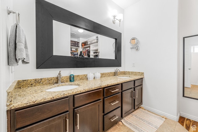 839 W Jordan Oaks Ct S, Sandy, UT 84070 - bathroom with double vanity, baseboards, and a spacious closet