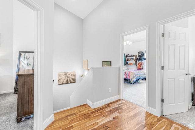 839 W Jordan Oaks Ct S, Sandy, UT 84070 - hallway with an upstairs landing, wood finished floors, baseboards, carpet, and high vaulted ceiling