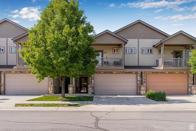 839 W Jordan Oaks Ct S, Sandy, UT 84070 - view of front of house with stone siding, a garage, and driveway