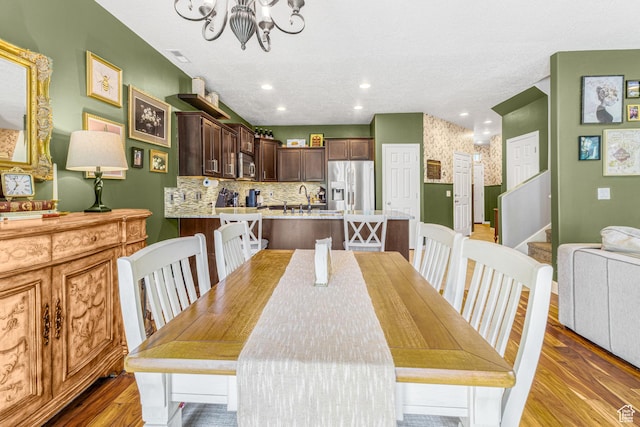 839 W Jordan Oaks Ct S, Sandy, UT 84070 - dining room featuring a chandelier, light wood-style flooring, a textured ceiling, and recessed lighting