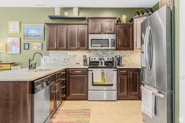 839 W Jordan Oaks Ct S, Sandy, UT 84070 - kitchen featuring stainless steel appliances, a peninsula, a sink, and tasteful backsplash