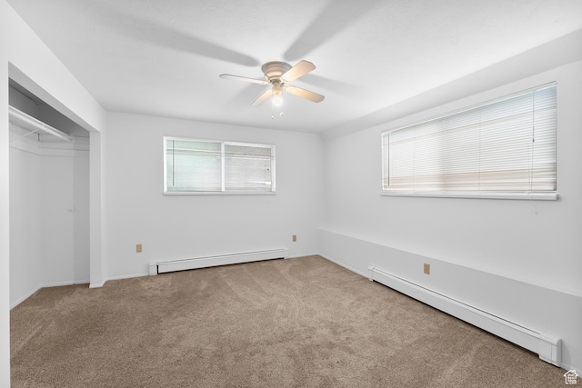 1173 N 350 W, Centerville, UT 84014 - unfurnished bedroom featuring a baseboard radiator, carpet, a ceiling fan, and a closet