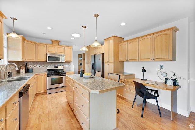 1173 N 350 W, Centerville, UT 84014 - kitchen with appliances with stainless steel finishes, a sink, light brown cabinetry, tile countertops, and a kitchen island