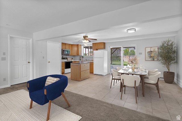 1173 N 350 W, Centerville, UT 84014 - dining space featuring light tile patterned floors, a ceiling fan, baseboards, and light carpet