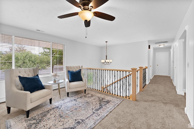 1173 N 350 W, Centerville, UT 84014 - living area featuring carpet floors, a chandelier, a baseboard radiator, an upstairs landing, and ceiling fan