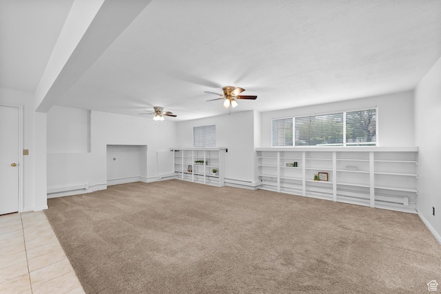1173 N 350 W, Centerville, UT 84014 - unfurnished living room with a ceiling fan, light carpet, light tile patterned floors, baseboard heating, and baseboards