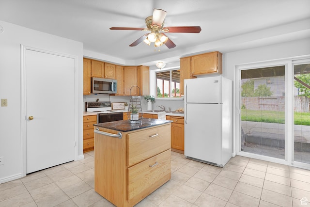 1173 N 350 W, Centerville, UT 84014 - kitchen featuring freestanding refrigerator, stainless steel microwave, electric range oven, ceiling fan, and light tile patterned floors