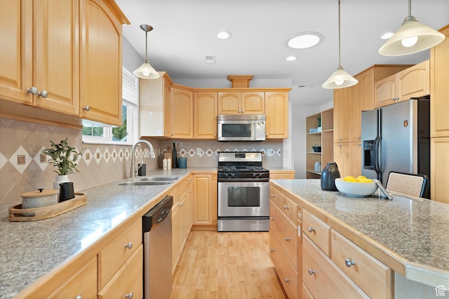 1173 N 350 W, Centerville, UT 84014 - kitchen with stainless steel appliances, a sink, light brown cabinets, light wood-type flooring, and tasteful backsplash