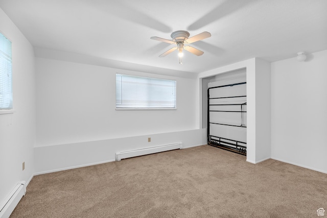1173 N 350 W, Centerville, UT 84014 - unfurnished bedroom featuring a baseboard radiator, carpet, a ceiling fan, and baseboards
