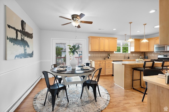 1173 N 350 W, Centerville, UT 84014 - dining space featuring a baseboard radiator, light wood finished floors, a ceiling fan, and recessed lighting