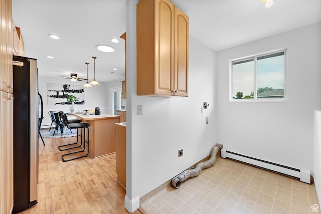 1173 N 350 W, Centerville, UT 84014 - laundry room with a baseboard heating unit, healthy amount of natural light, ceiling fan, light wood-style flooring, and recessed lighting