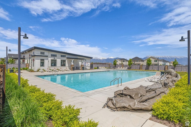 7185 N Hidden Steppe Bnd, Eagle Mountain, UT 84005 - community pool with a patio area and a mountain view