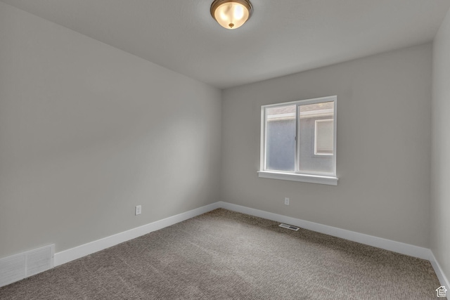 7185 N Hidden Steppe Bnd, Eagle Mountain, UT 84005 - spare room featuring baseboards and carpet
