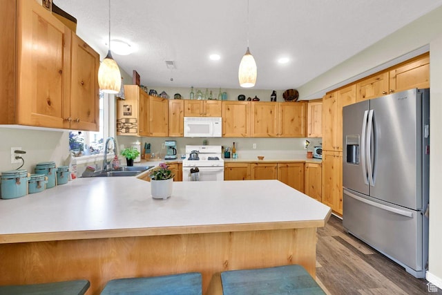 1427 S Blossom Ln, Ogden, UT 84404 - kitchen featuring white appliances, a sink, a peninsula, light countertops, and pendant lighting