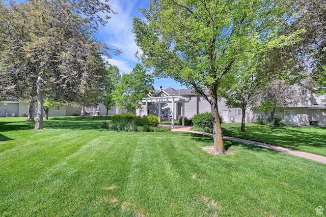 1427 S Blossom Ln, Ogden, UT 84404 - view of grassy yard with a pergola and a residential view