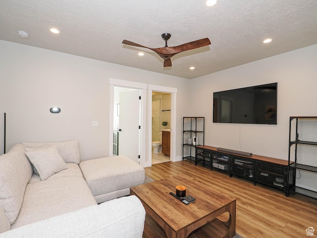 423 E 2100 S Unit 204, Salt Lake City, UT 84115 - living area featuring a ceiling fan, wood finished floors, recessed lighting, and a textured ceiling
