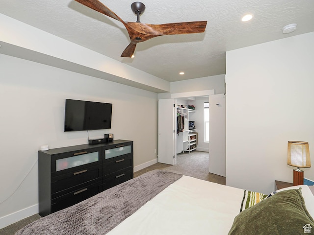 423 E 2100 S Unit 204, Salt Lake City, UT 84115 - bedroom with carpet, baseboards, ceiling fan, a spacious closet, and recessed lighting
