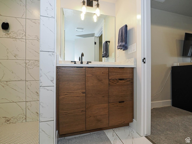 423 E 2100 S Unit 204, Salt Lake City, UT 84115 - bathroom with marble finish floors, walk in shower, and vanity