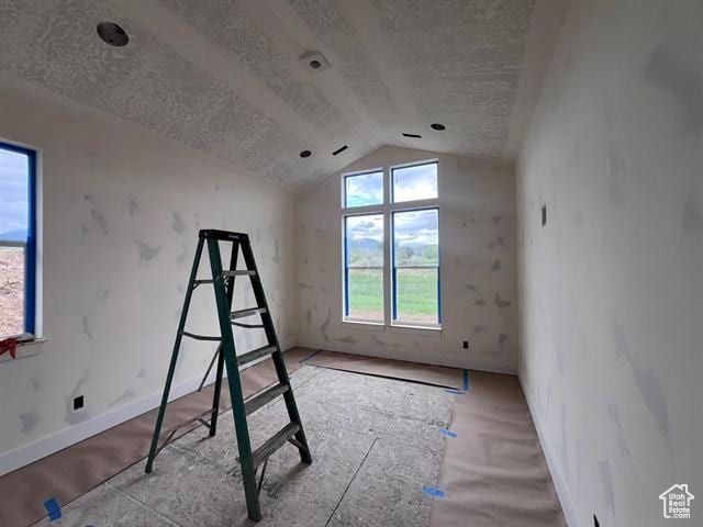 1409 Geer, Mccammon, ID 83250 - unfurnished bedroom featuring a textured ceiling, lofted ceiling, and baseboards