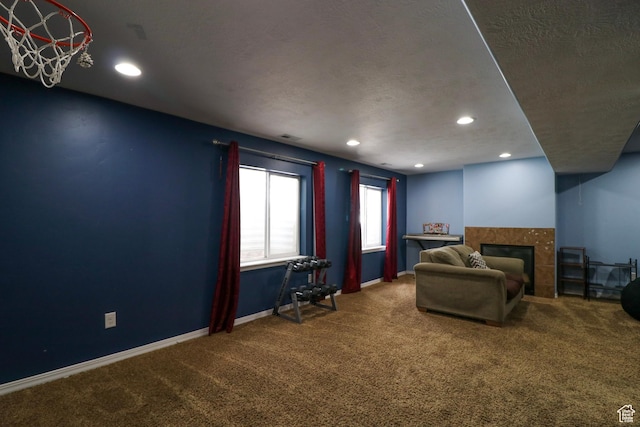 6466 W 8375 S, West Jordan, UT 84081 - carpeted living area featuring a fireplace, recessed lighting, a textured ceiling, and baseboards