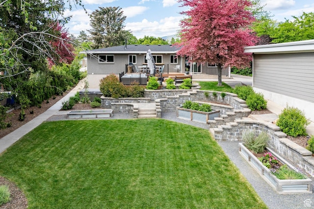 2262 E 1700 S, Salt Lake City, UT 84108 - view of green lawn with a vegetable garden and a wooden deck