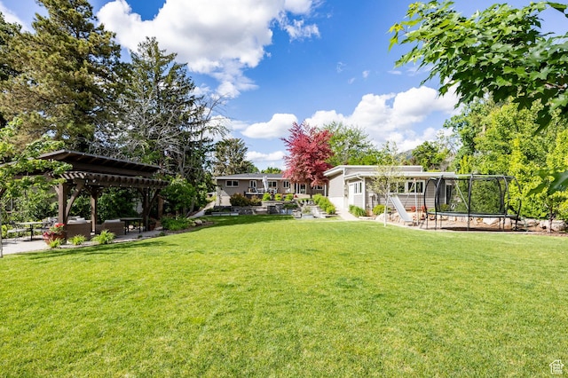 2262 E 1700 S, Salt Lake City, UT 84108 - view of green lawn featuring a trampoline, a pergola, and a patio area