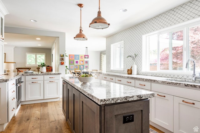 2262 E 1700 S, Salt Lake City, UT 84108 - kitchen with a sink, light wood finished floors, recessed lighting, a center island, and oven