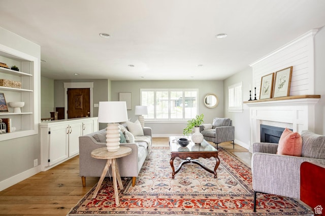 2262 E 1700 S, Salt Lake City, UT 84108 - living room with light wood-style flooring, a fireplace, baseboards, and recessed lighting