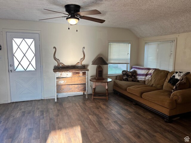 145 N 200 W, Roosevelt, UT 84066 - living area featuring a textured ceiling, healthy amount of natural light, dark wood-style floors, a ceiling fan, and vaulted ceiling