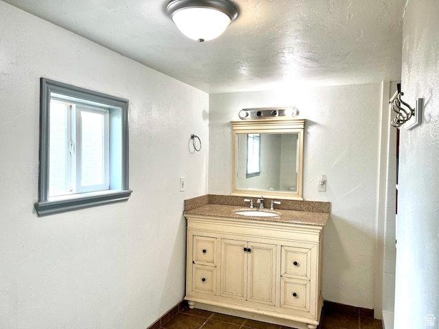 145 N 200 W, Roosevelt, UT 84066 - bathroom featuring vanity, healthy amount of natural light, and tile patterned flooring