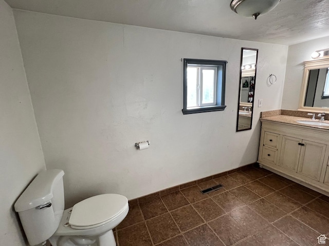 145 N 200 W, Roosevelt, UT 84066 - half bath featuring vanity and tile patterned flooring