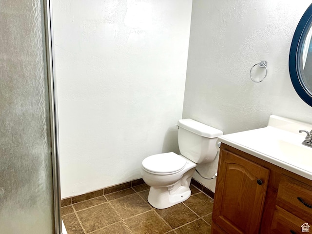 145 N 200 W, Roosevelt, UT 84066 - bathroom with vanity, tile patterned flooring, and a shower with door