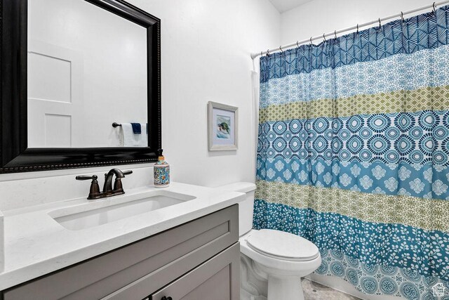 670 N Lake Sight Dr, Garden City, UT 84028 - bathroom with toilet, vanity, and curtained shower